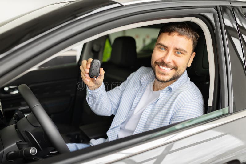 files/happy-young-man-sitting-new-car-dealership-holding-key-fob-driver-seat-toward-camera-smiling-male-buyer-poses-458278807.jpg
